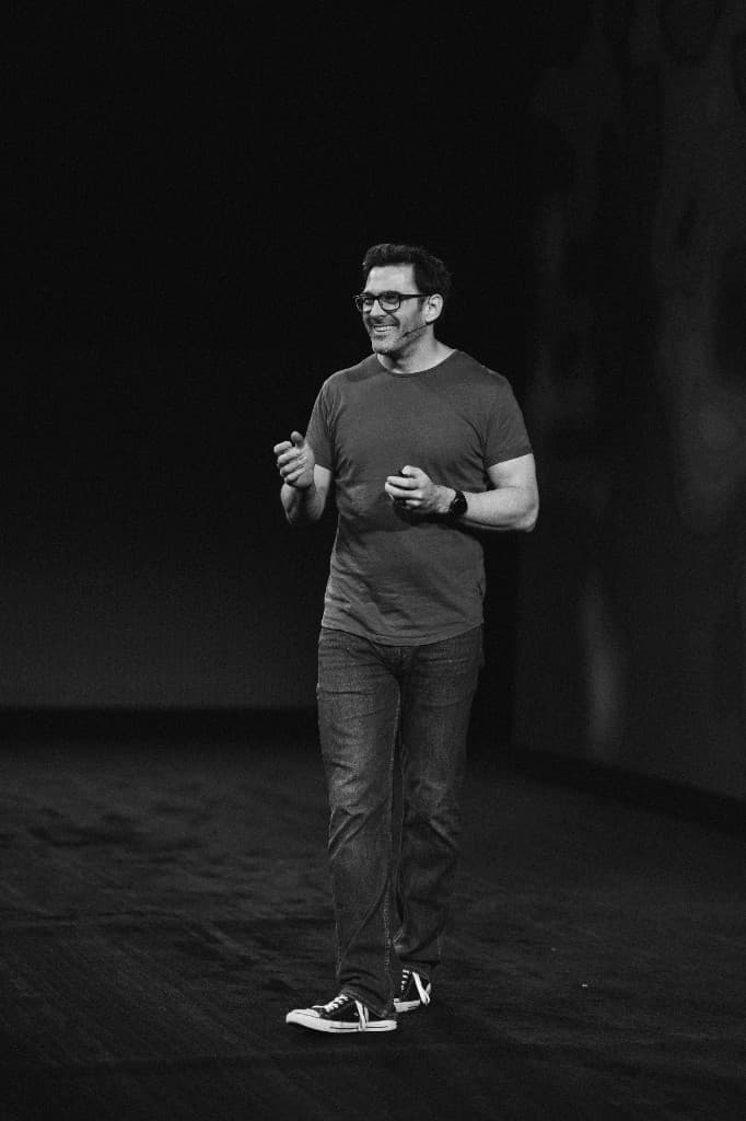 A speaker walking across the main stage